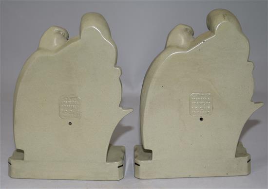 A pair of Poole Pottery Lovebirds bookends and another similar bookend, largest 7.75in.